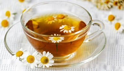 cup of tea with daisies